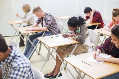 students-writing-their-gcse-exam-in-classroom-525409725-5abe28f1ae9ab800373088ac.jpg
